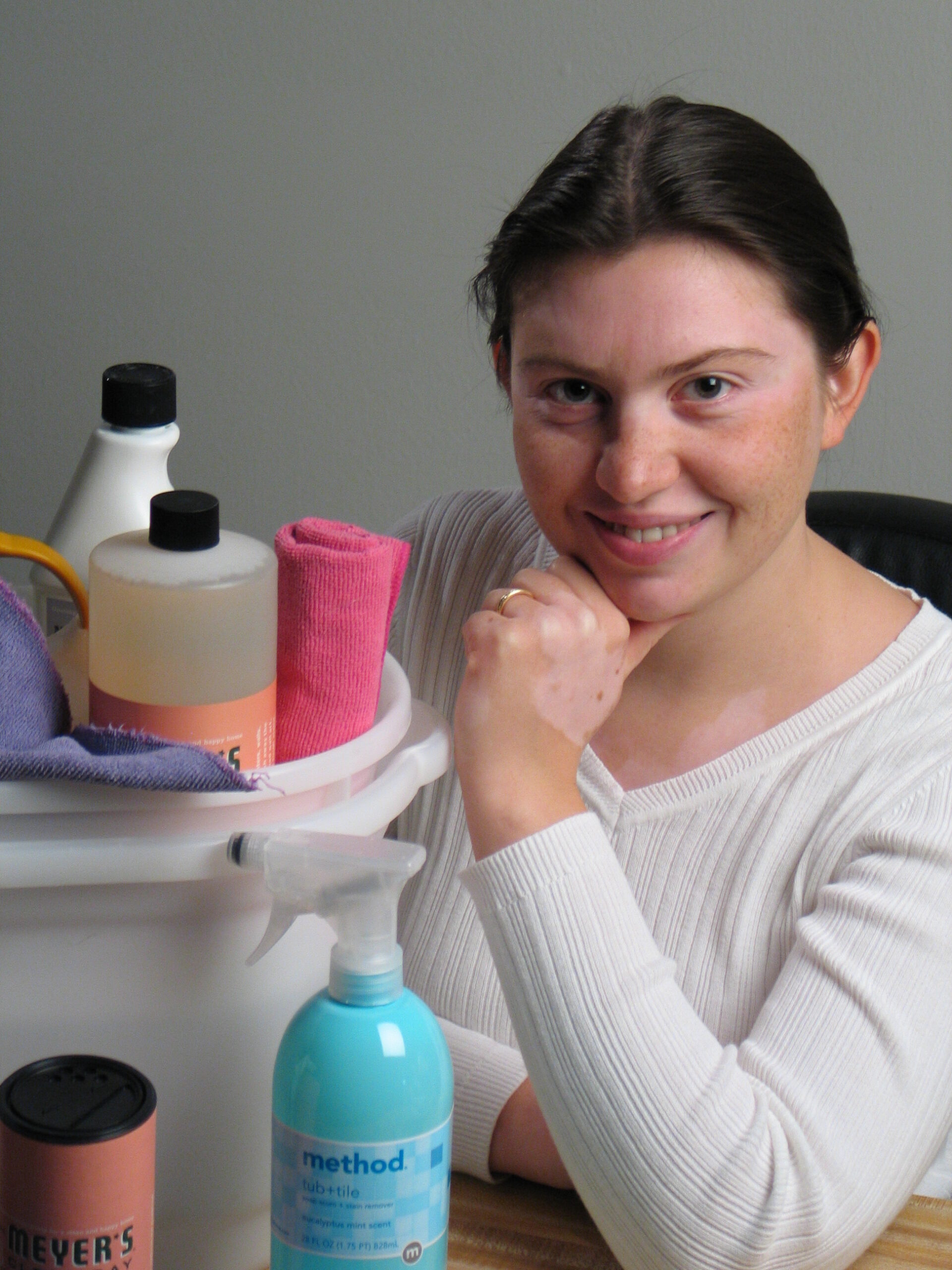 Image of Olga with cleaning supplies from her days at "Nature Maids"